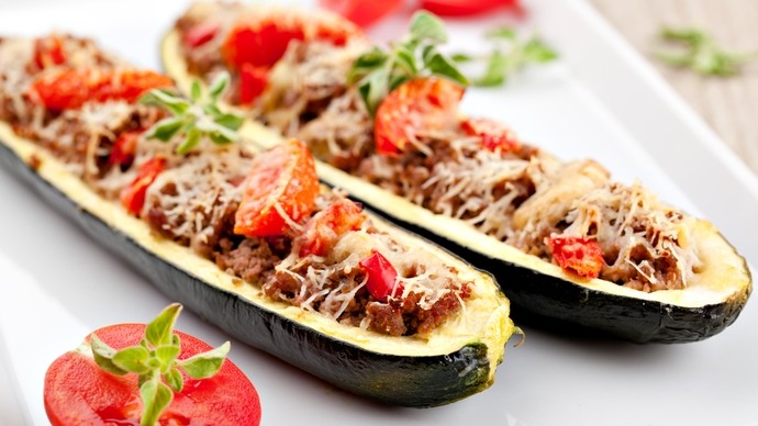 a halved marrow stuffed with beef mince and tomatoes