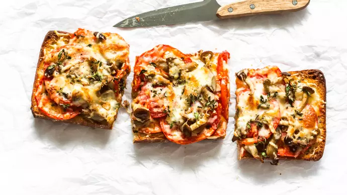 Squares of tomato and cheese topped pizza pieces