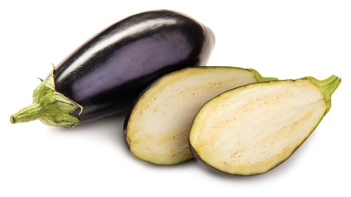 Two aubergines, one whole and one sliced in half lengthways