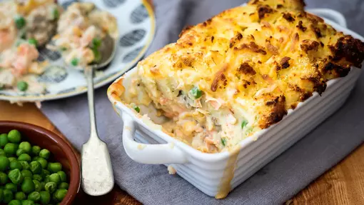 Traybake of creamy fish pie topped with crispy mash potato