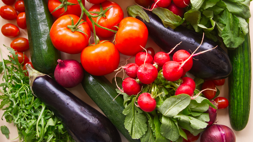 Aubergines amongst tomatoes and radishes