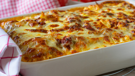 A tray bake in shades of gold and orange squash filled with mince