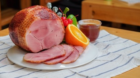 Joint of sliced gammon plated on a table