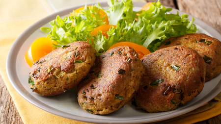 four crispy tuna fishcakes served with fresh green salad
