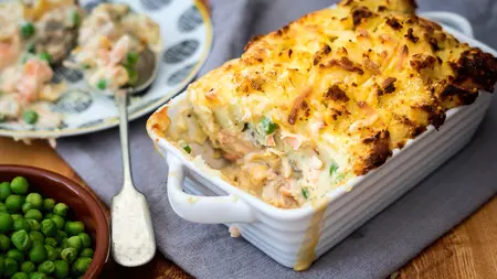 Traybake of creamy fish pie topped with crispy mash potato