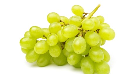 A bunch of green grapes on a white background