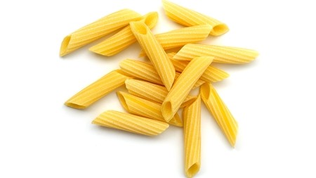 a small pile of dried penne pasta