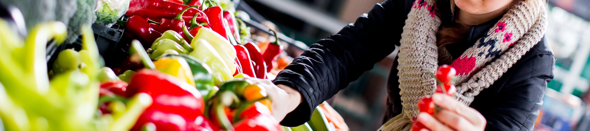 young person shopping in fresh food ailse in supermarket